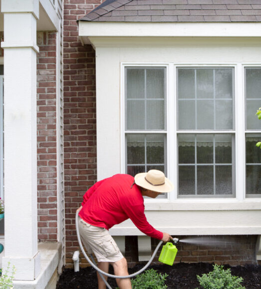 Man,Cleaning,The,Underside,Of,A,Bay,Or,Bump-out,Window